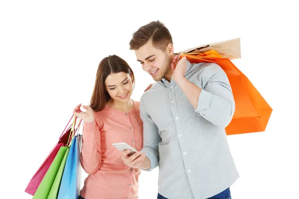 Pareja con coloridas bolsas de compras — Foto de Stock