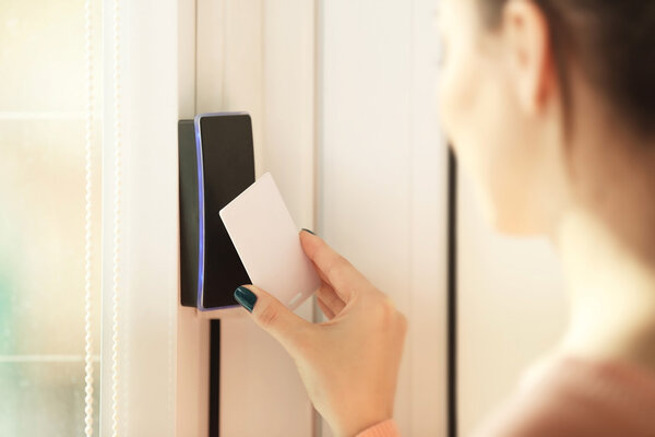 Woman setting security system 