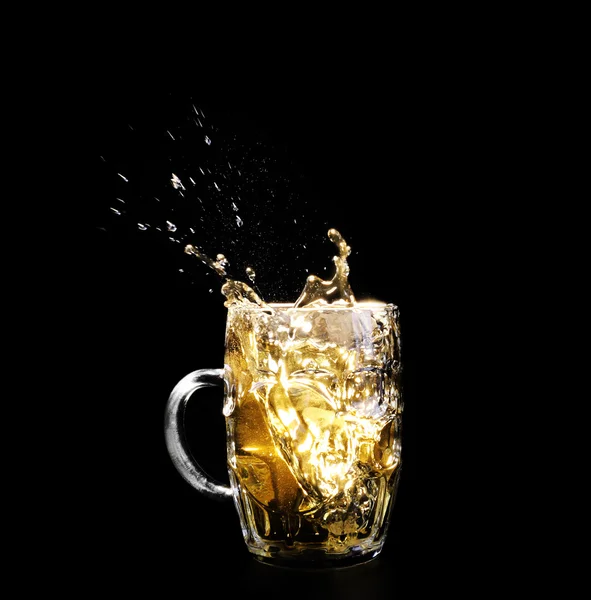 Glass of beer on black background — Stock Photo, Image