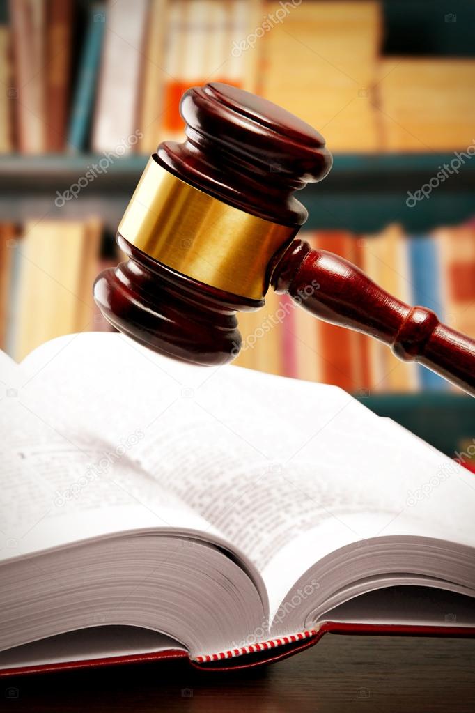 Judge gavel and books on table 