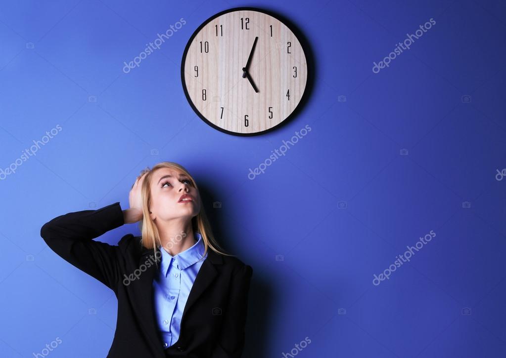 Attractive woman under clock Stock Photo by ©belchonock 103979748