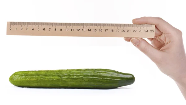 Hand with ruler and cucumber — Stock Photo, Image