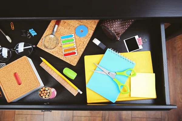 Stationery in open desk drawer — Stock Photo, Image