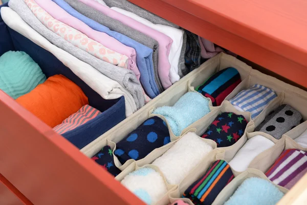 Folded clothes in chest of drawers — Stock Photo, Image