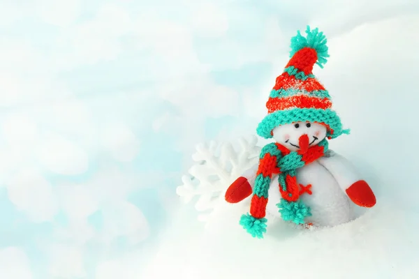 Beautiful snowman on natural snowdrift — Stock Photo, Image