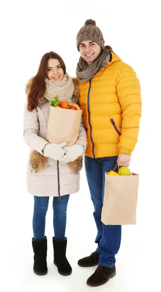 Pareja joven con bolsas de papel — Foto de Stock