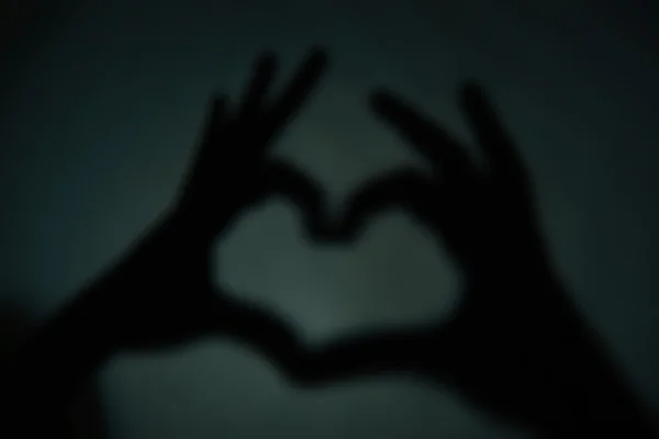 Corazón en forma de mano sobre fondo — Foto de Stock