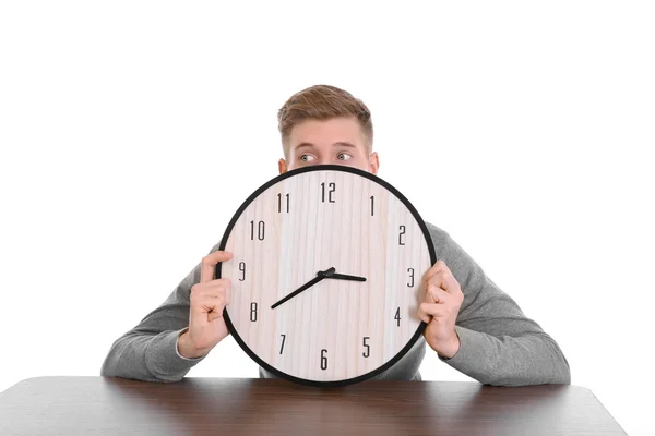 Young handsome man holding clock — Stock Photo, Image