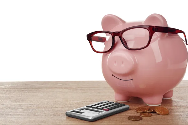 Piggy bank rosa com óculos — Fotografia de Stock