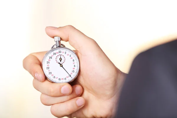 Stopwatch in de hand oclose van — Stockfoto