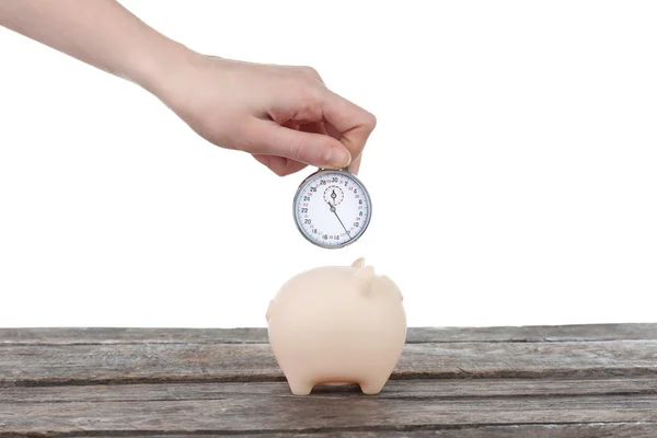 Piggy bank en hand bedrijf timer — Stockfoto