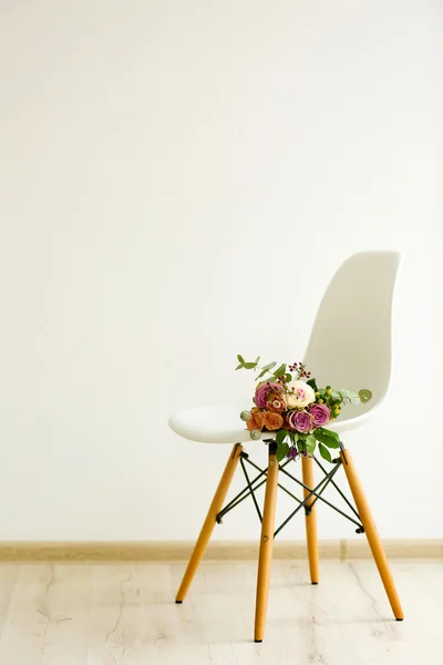 Bouquet of roses on a chair Stock Image