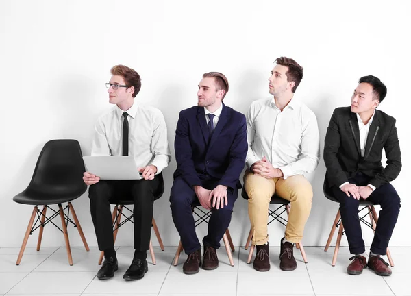 Businessmen sitting on chairs — Stock Photo, Image