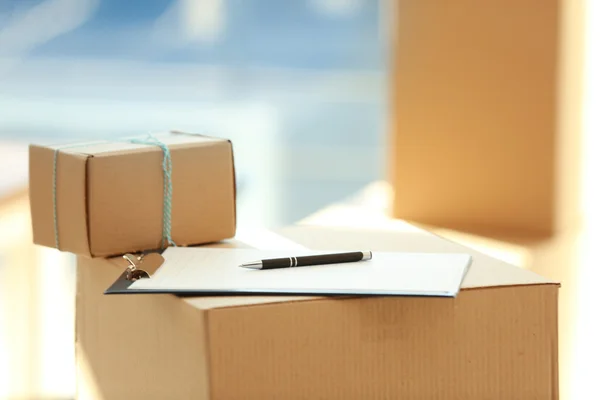 Group of parcels with clipboard — Stock Photo, Image