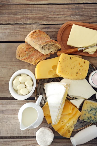 Set of fresh dairy products on old  wooden table, close up — Stock Photo, Image