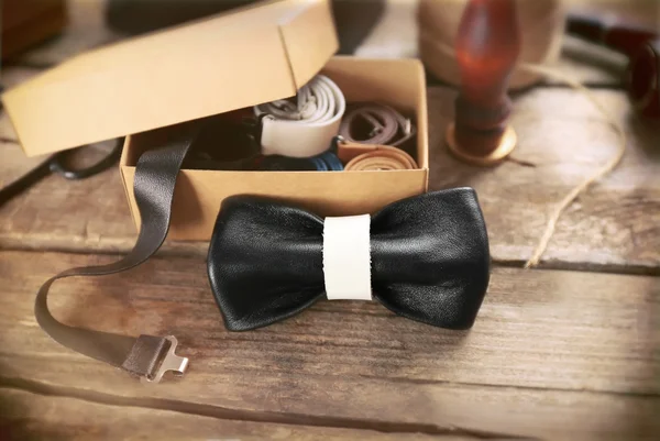 Bow tie on wooden table — Stock Photo, Image