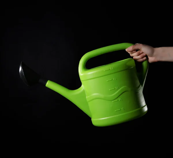 Hand holding watering can — Stock Photo, Image