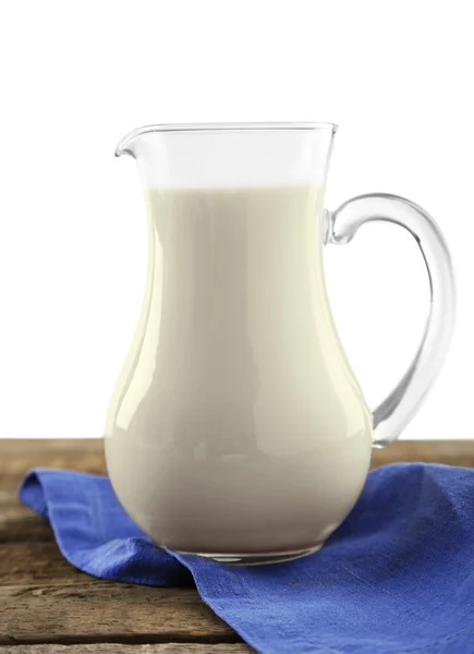 Jug of milk on wooden table — Stock Photo, Image