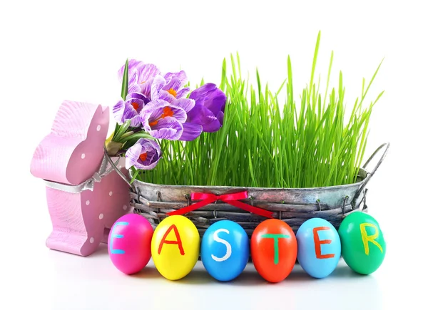 Multicoloured Easter eggs in  wicker bowl — Stock Photo, Image