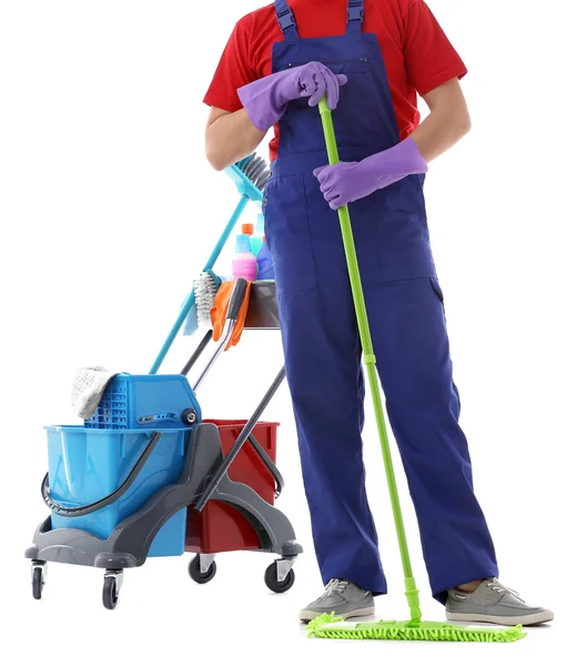 Young janitor with cleaner cart — Stock Photo, Image