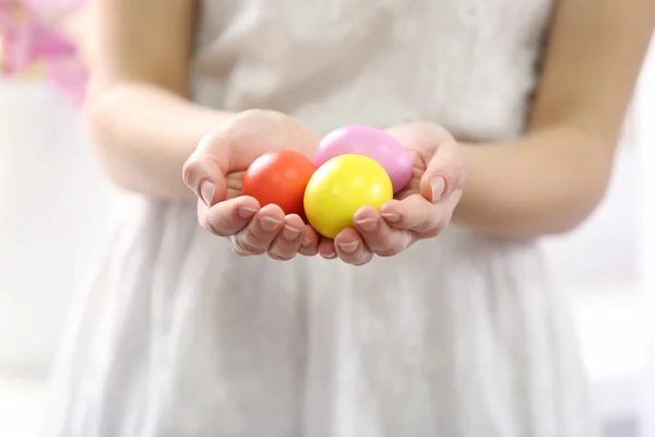 Hands holding Easter eggs — Stock Photo, Image