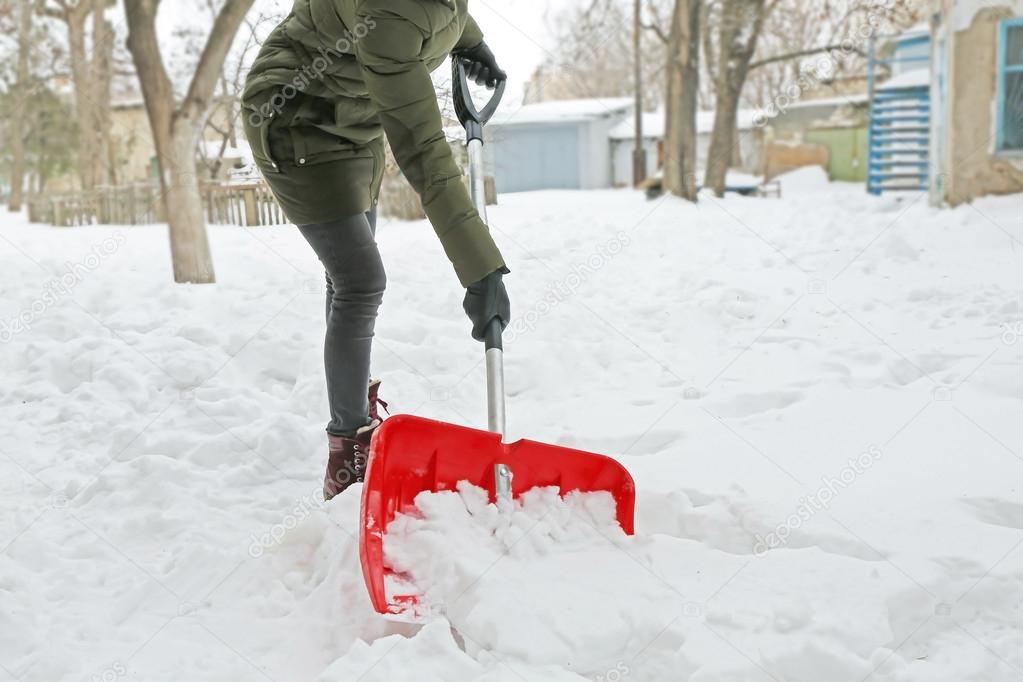 Woman removing snow 