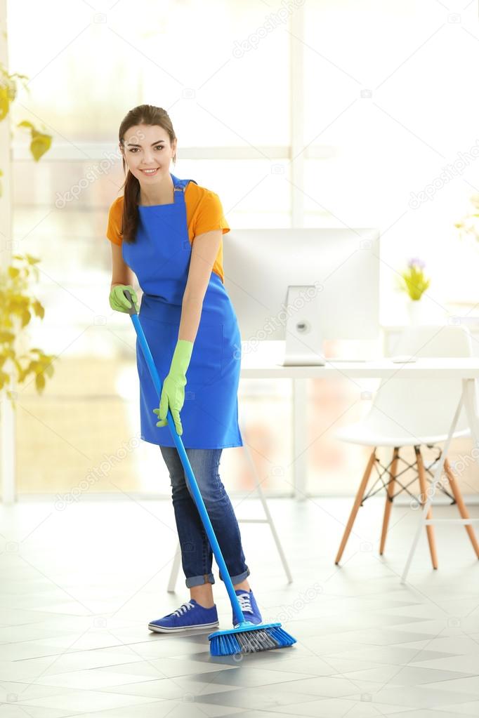 Woman cleaning floor Stock Photo by ©belchonock 104356960