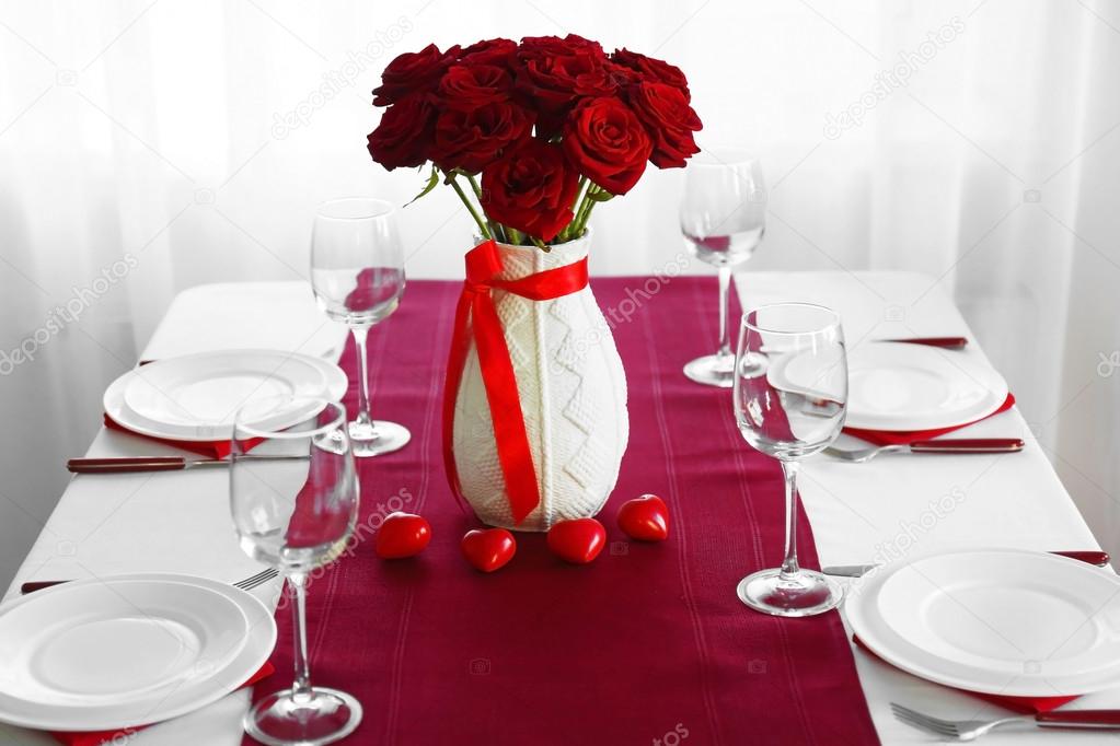 depositphotos_104357812-stock-photo-vase-with-red-roses-on.jpg