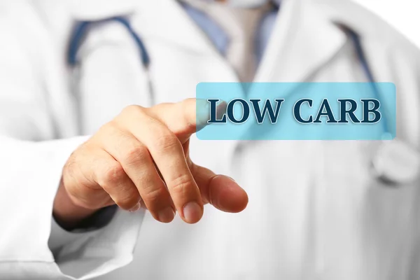 Doctor pointing on Low-Carb button — Stock Photo, Image