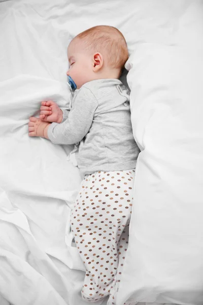 Loving baby with dummy sleeping — Stock Photo, Image