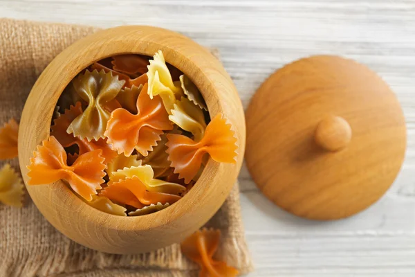 Raw pasta on wooden table, top view — Stock Photo, Image