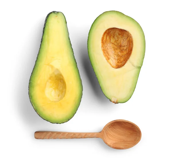 Avocado en houten lepel geïsoleerd op wit — Stockfoto