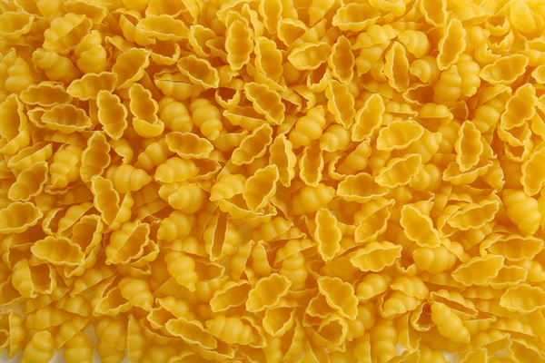 Italian dry pasta background, top view — Stock Photo, Image