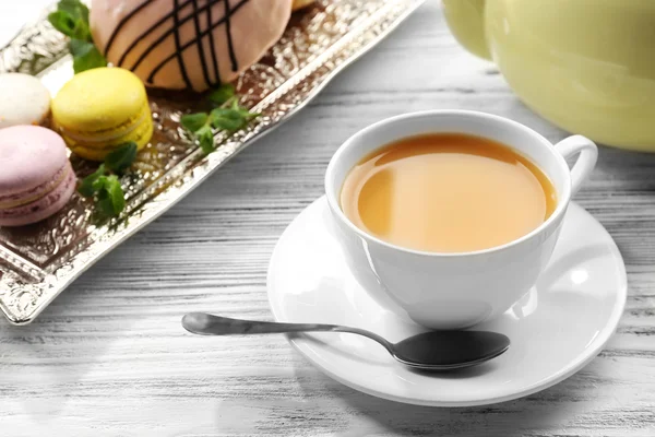 Coffee with macaroons on wooden background — Stock Photo, Image