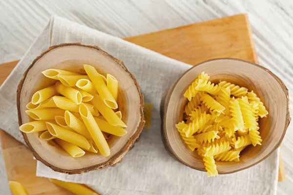 Raw pasta on napkins, top view — Stock Photo, Image