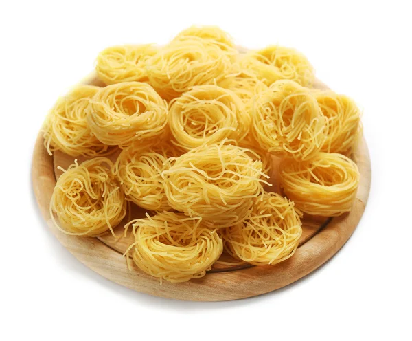 Bird's nests pasta on a wooden board, close up — Stock Photo, Image