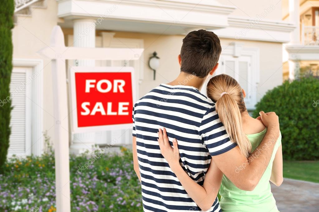 couple looking at dream house  