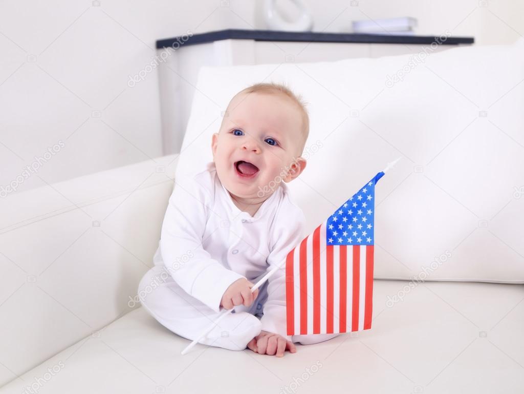 Cute baby boy with American flag Stock Photo by ©belchonock 104970680
