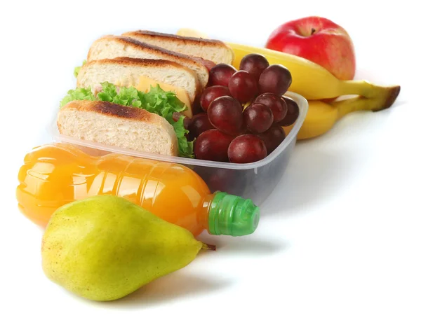 Pranzo sano a scuola con panino, frutta e succo isolato su bianco — Foto Stock