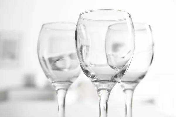 Wineglasses on blurred interior — Stock Photo, Image