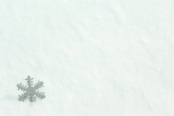 Beautiful snowflake on natural snowdrift — Stock Photo, Image