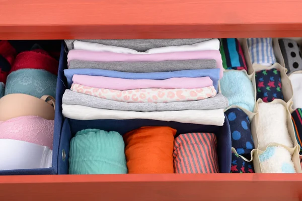 Folded clothes in chest of drawers — Stock Photo, Image