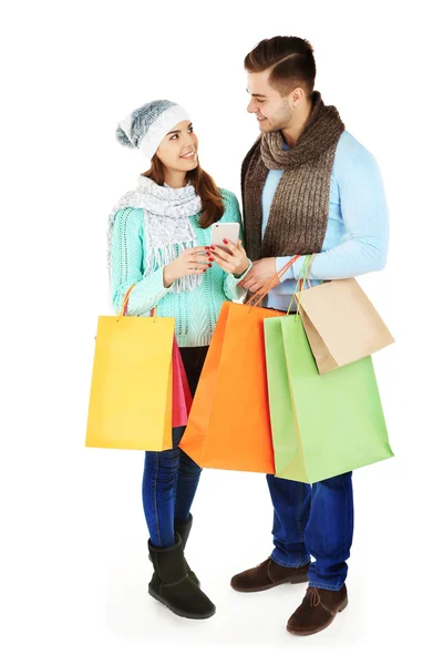 Casal com sacos de compras coloridos — Fotografia de Stock