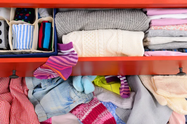 Pile of clothes in open drawer — Stock Photo, Image