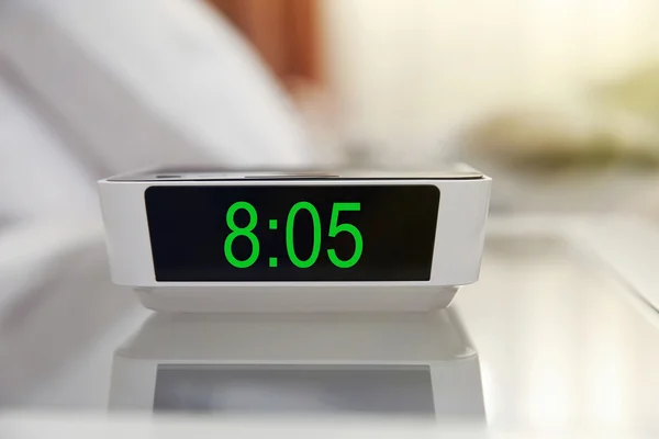 Digital clock in bedroom — Stock Photo, Image