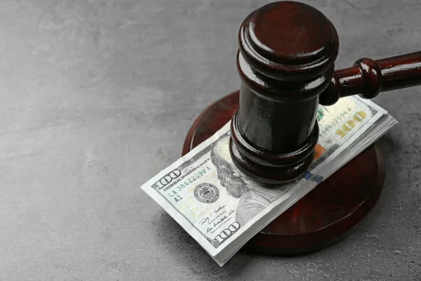 Law gavel with dollars — Stock Photo, Image