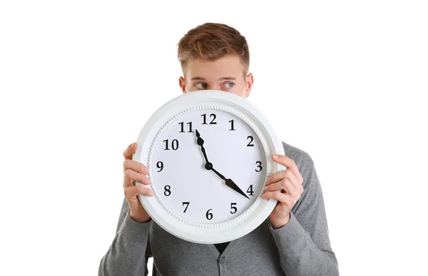 Young handsome man holding clock — Stock Photo, Image