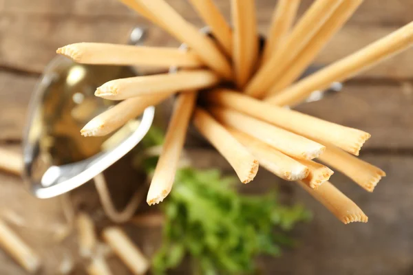 Palitos de pan con rúcula y aceite, primer plano —  Fotos de Stock