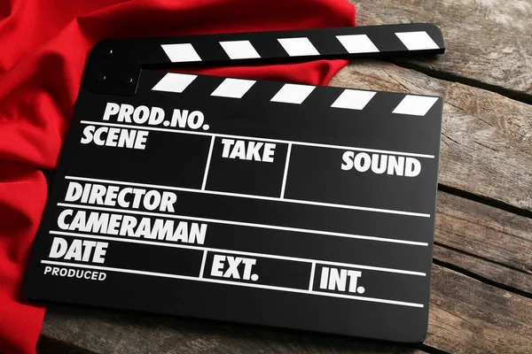 Movie clapper on wooden board — Stock Photo, Image