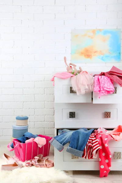 Clothes in wooden chest of drawer — Stock Photo, Image